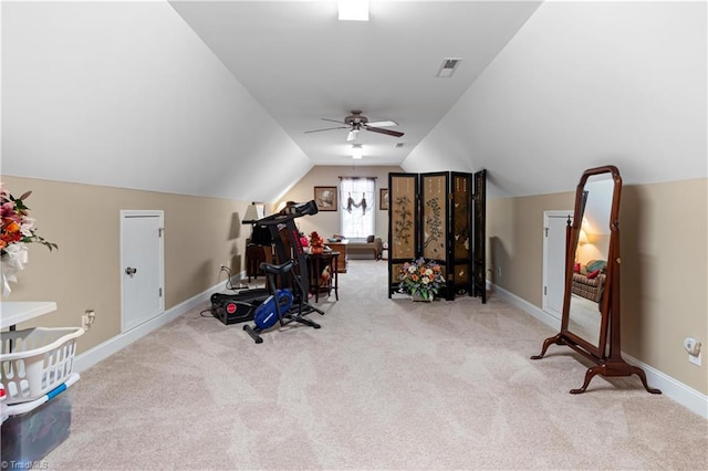 workout area featuring light carpet, lofted ceiling, and ceiling fan