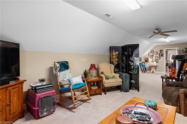 living room with lofted ceiling, light colored carpet, and ceiling fan