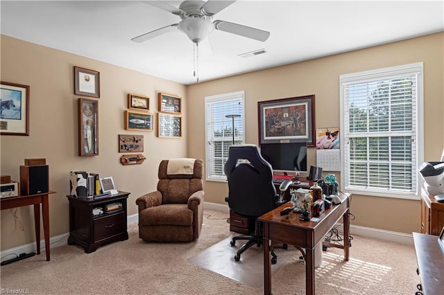 office space featuring light colored carpet and ceiling fan