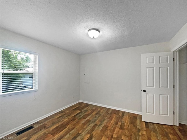 310 Cole St, Thomasville, NC 27360 - unfurnished room with dark wood-type flooring and a textured ceiling