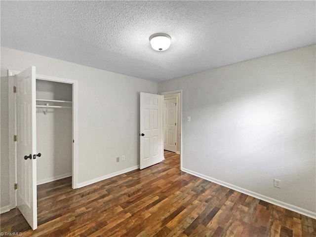 310 Cole St, Thomasville, NC 27360 - unfurnished bedroom featuring wood finished floors, a closet, and a textured ceiling
