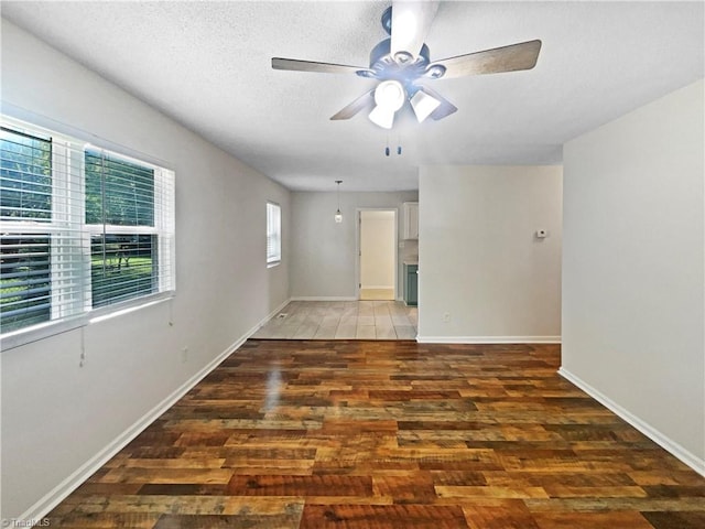 310 Cole St, Thomasville, NC 27360 - empty room featuring wood finished floors, ceiling fan, and a textured ceiling