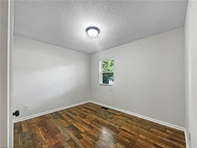 310 Cole St, Thomasville, NC 27360 - empty room featuring dark wood-type flooring and a textured ceiling