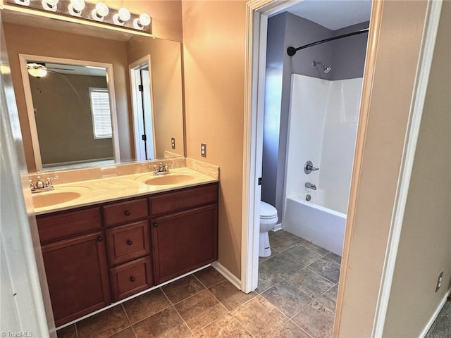 full bathroom featuring vanity, shower / washtub combination, ceiling fan, and toilet