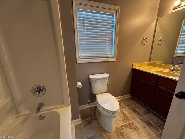 full bathroom featuring vanity, plenty of natural light, bathing tub / shower combination, and toilet