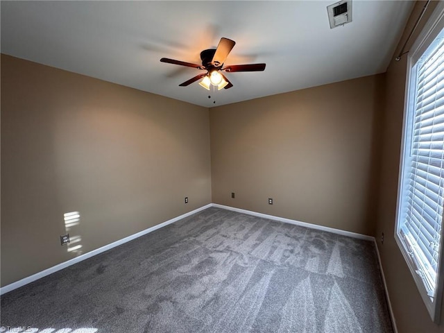 empty room with carpet and ceiling fan