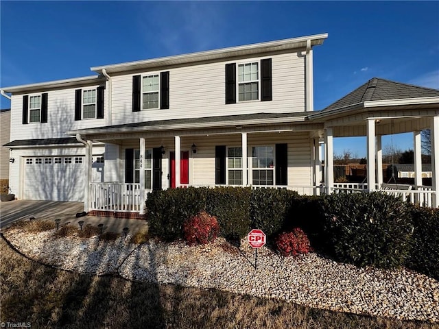 view of front of house featuring a garage and a porch