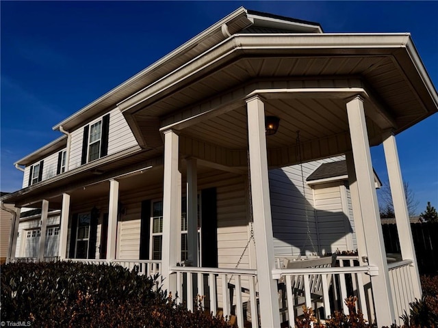 view of property exterior with a porch