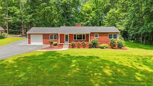 465 NC Highway 42 S, Asheboro, NC 27205 - ranch-style home featuring an attached garage, a chimney, asphalt driveway, and brick siding