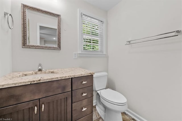 465 NC Highway 42 S, Asheboro, NC 27205 - half bathroom featuring toilet, vanity, and baseboards