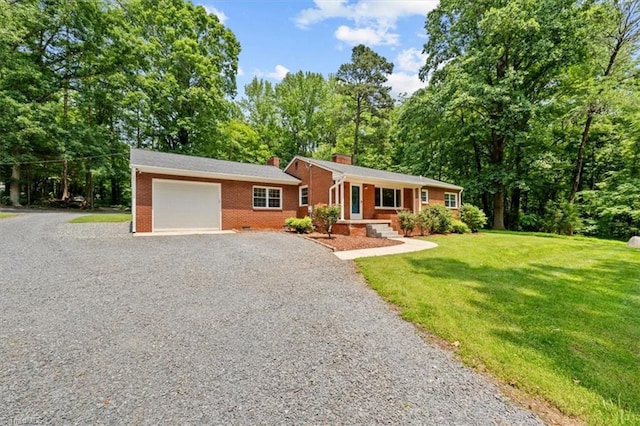 465 NC Highway 42 S, Asheboro, NC 27205 - single story home with gravel driveway, a chimney, an attached garage, a front yard, and brick siding