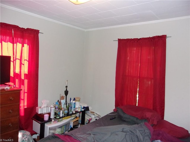 bedroom with crown molding