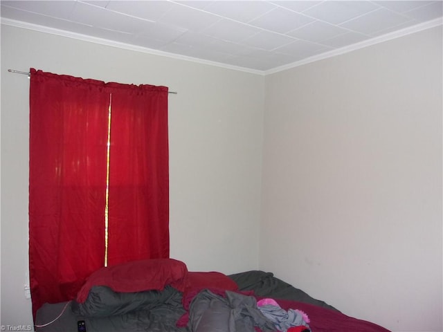 bedroom with crown molding