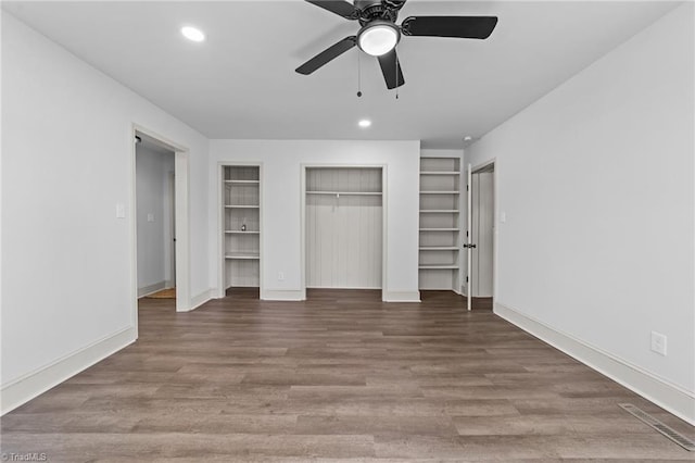 unfurnished bedroom featuring baseboards, visible vents, wood finished floors, and recessed lighting