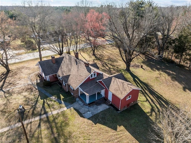 aerial view featuring a wooded view