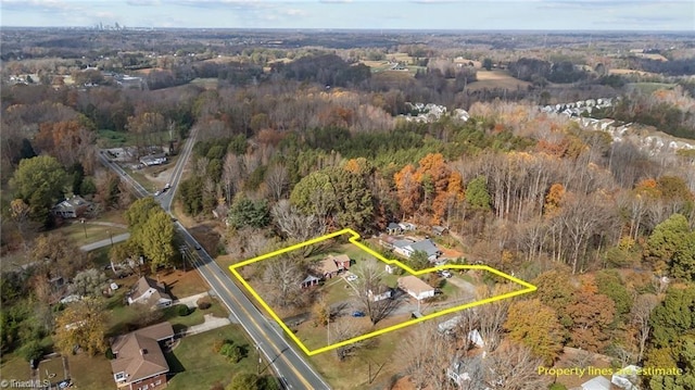 bird's eye view featuring a view of trees