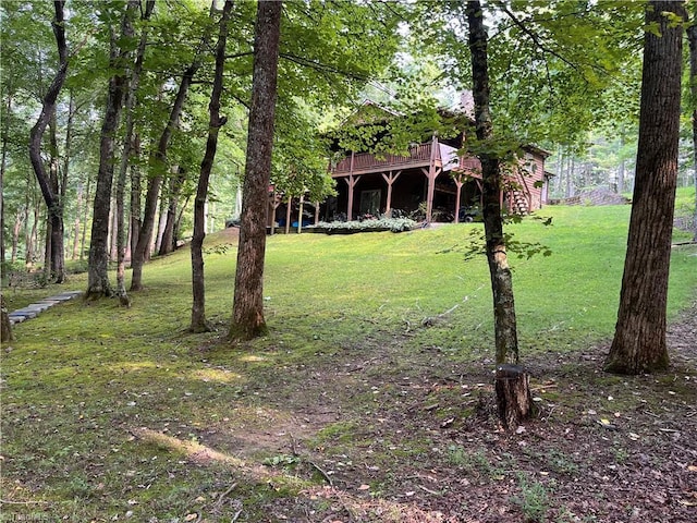 view of yard featuring a wooden deck