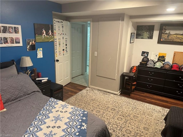 bedroom with hardwood / wood-style floors