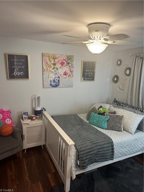 bedroom featuring dark wood-type flooring