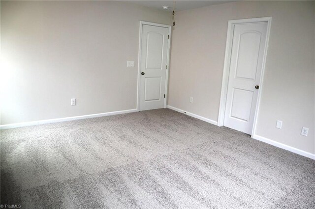 1100 Brooksridge Way, Whitsett, NC 27377 - carpeted empty room featuring baseboards