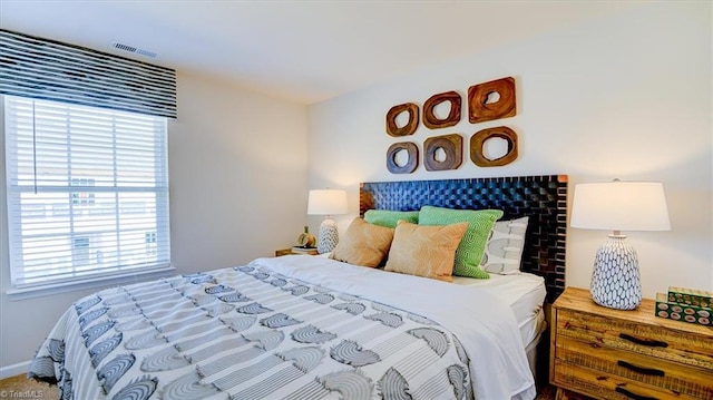 bedroom featuring visible vents