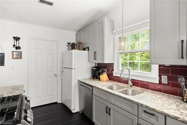 1118 Still Meadows Ln, King, NC 27021 - kitchen featuring stainless steel appliances, a sink, dark wood-type flooring, decorative backsplash, and crown molding