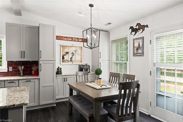 1118 Still Meadows Ln, King, NC 27021 - dining area featuring dark wood-style flooring, plenty of natural light, a chandelier, and vaulted ceiling