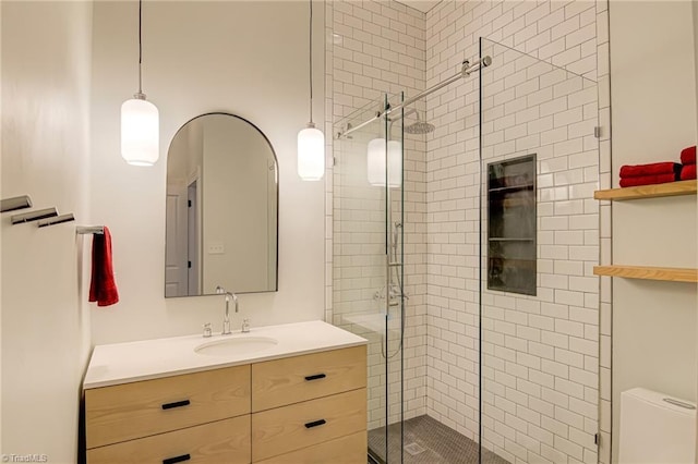 full bath featuring a shower stall and vanity