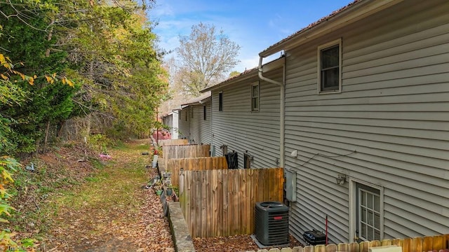 view of side of property featuring central AC