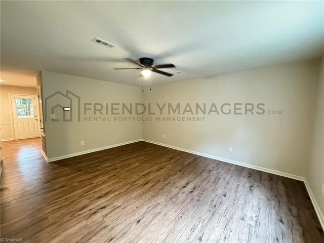 empty room featuring ceiling fan and wood-type flooring