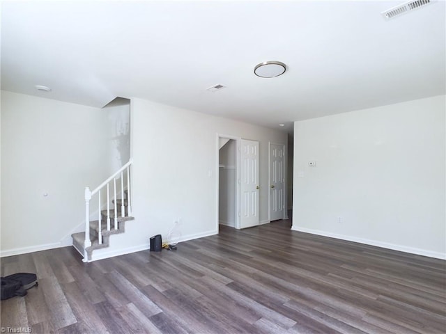 unfurnished room with dark hardwood / wood-style floors