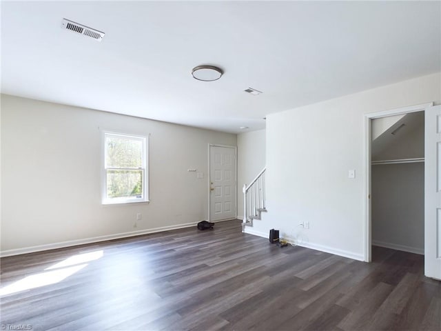 spare room with dark hardwood / wood-style floors