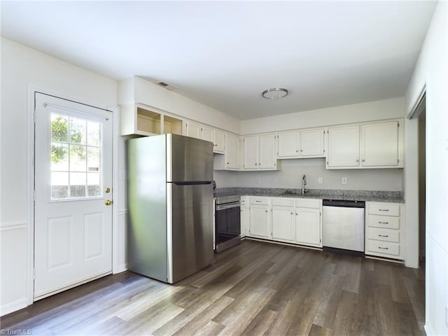 kitchen featuring sink, white cabinets, dark hardwood / wood-style floors, and appliances with stainless steel finishes