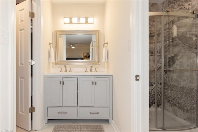 4166 Lytchfield Ct, Winston-Salem, NC 27104 - full bathroom with double vanity, a shower stall, ceiling fan, tile patterned flooring, and baseboards