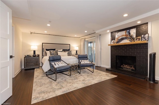 4166 Lytchfield Ct, Winston-Salem, NC 27104 - bedroom featuring access to exterior, wood finished floors, a brick fireplace, recessed lighting, and baseboards