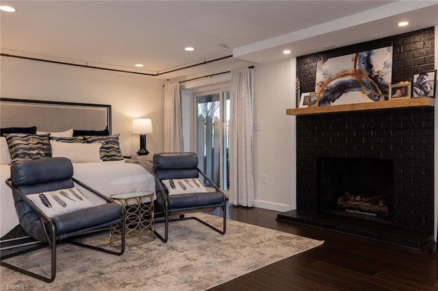 4166 Lytchfield Ct, Winston-Salem, NC 27104 - bedroom with wood finished floors, recessed lighting, baseboards, access to outside, and a large fireplace