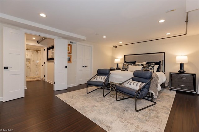 4166 Lytchfield Ct, Winston-Salem, NC 27104 - bedroom with dark wood finished floors, recessed lighting, and baseboards