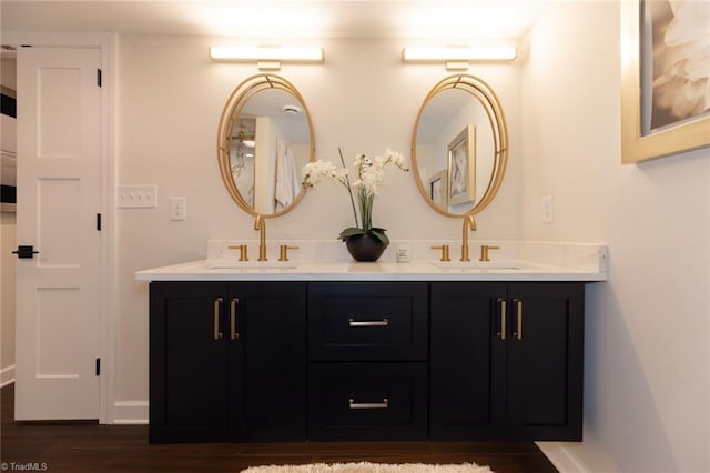 4166 Lytchfield Ct, Winston-Salem, NC 27104 - full bath featuring double vanity, wood finished floors, and baseboards