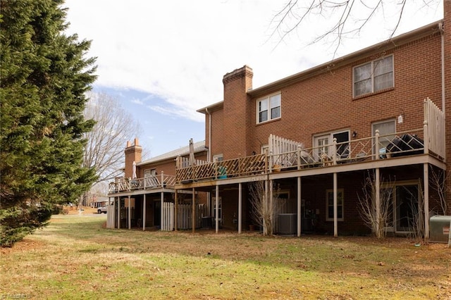 4166 Lytchfield Ct, Winston-Salem, NC 27104 - back of house with a chimney, a lawn, a deck, and brick siding