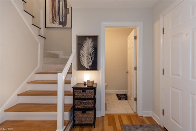 4166 Lytchfield Ct, Winston-Salem, NC 27104 - stairs featuring wood finished floors and baseboards