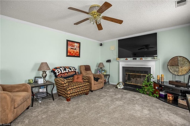 carpeted living room with crown molding, a textured ceiling, and ceiling fan