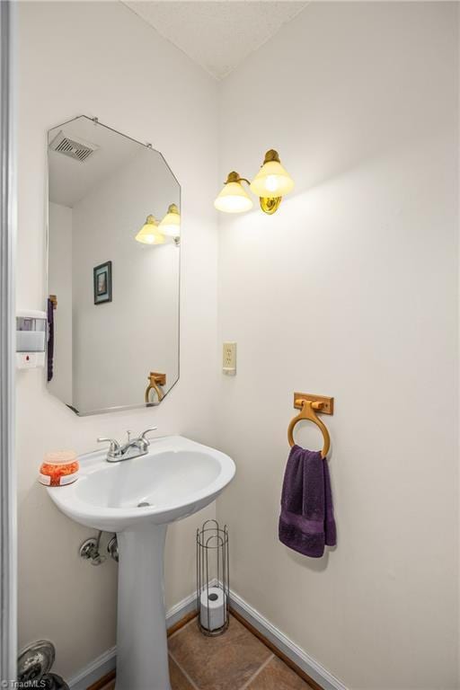 bathroom with tile patterned floors