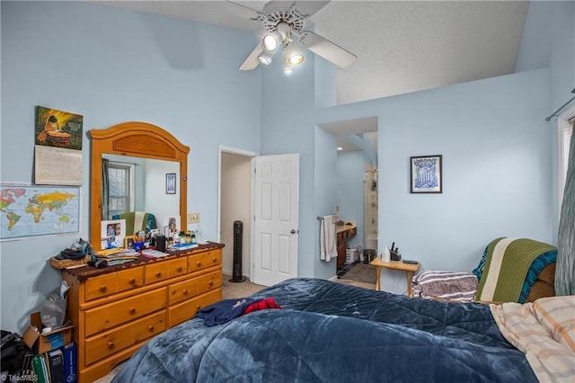 bedroom featuring light carpet, high vaulted ceiling, and ceiling fan