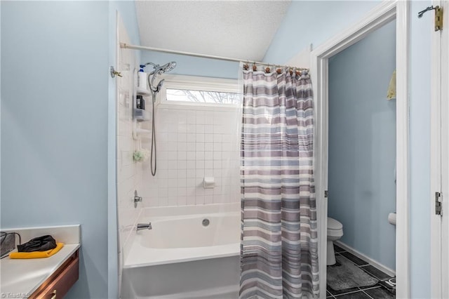 bathroom with tile patterned floors, toilet, shower / bath combo with shower curtain, and a textured ceiling