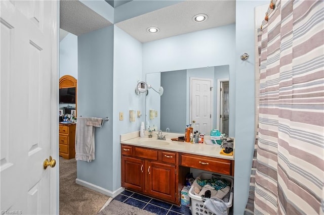 bathroom with vanity and tile patterned flooring