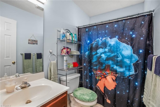 bathroom featuring vanity, curtained shower, and toilet