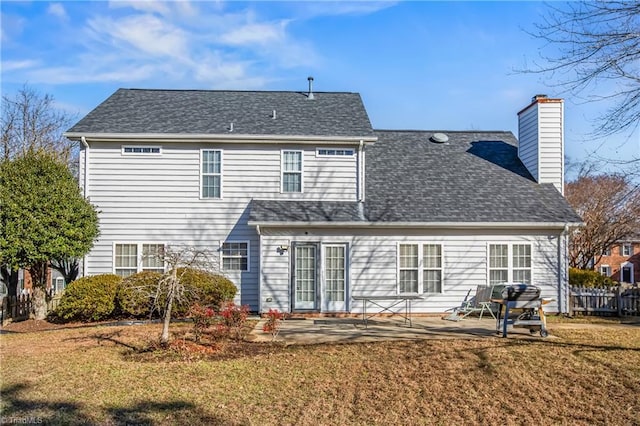 rear view of property with a patio area and a lawn