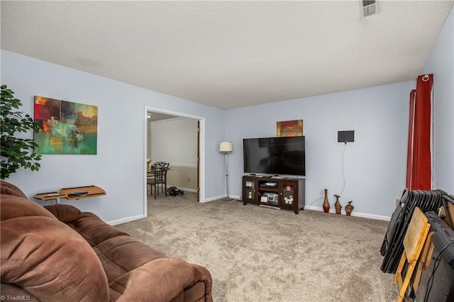 carpeted living room with a textured ceiling