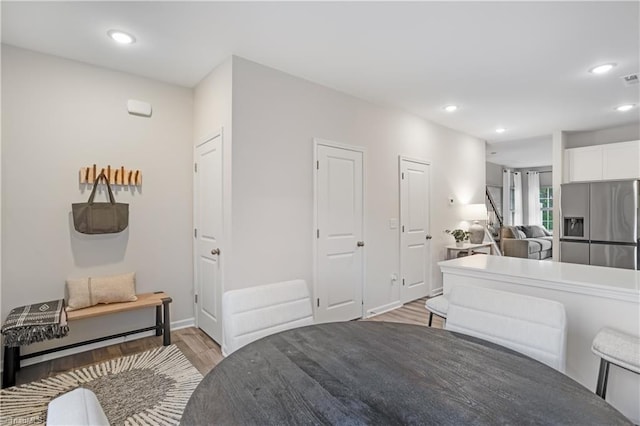 1868 Autumn Mist Dr, Winston-Salem, NC 27103 - bedroom with stainless steel refrigerator with ice dispenser, light wood finished floors, and recessed lighting