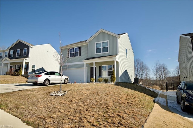 traditional-style home with board and batten siding, driveway, and a garage